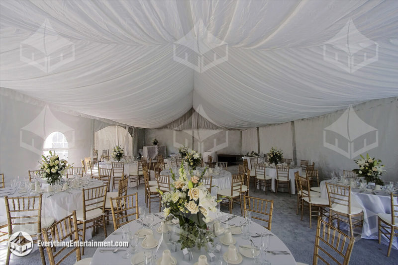 wedding-tent-rental-tent-liner-gold-chivalri-chairs-grey-carpet