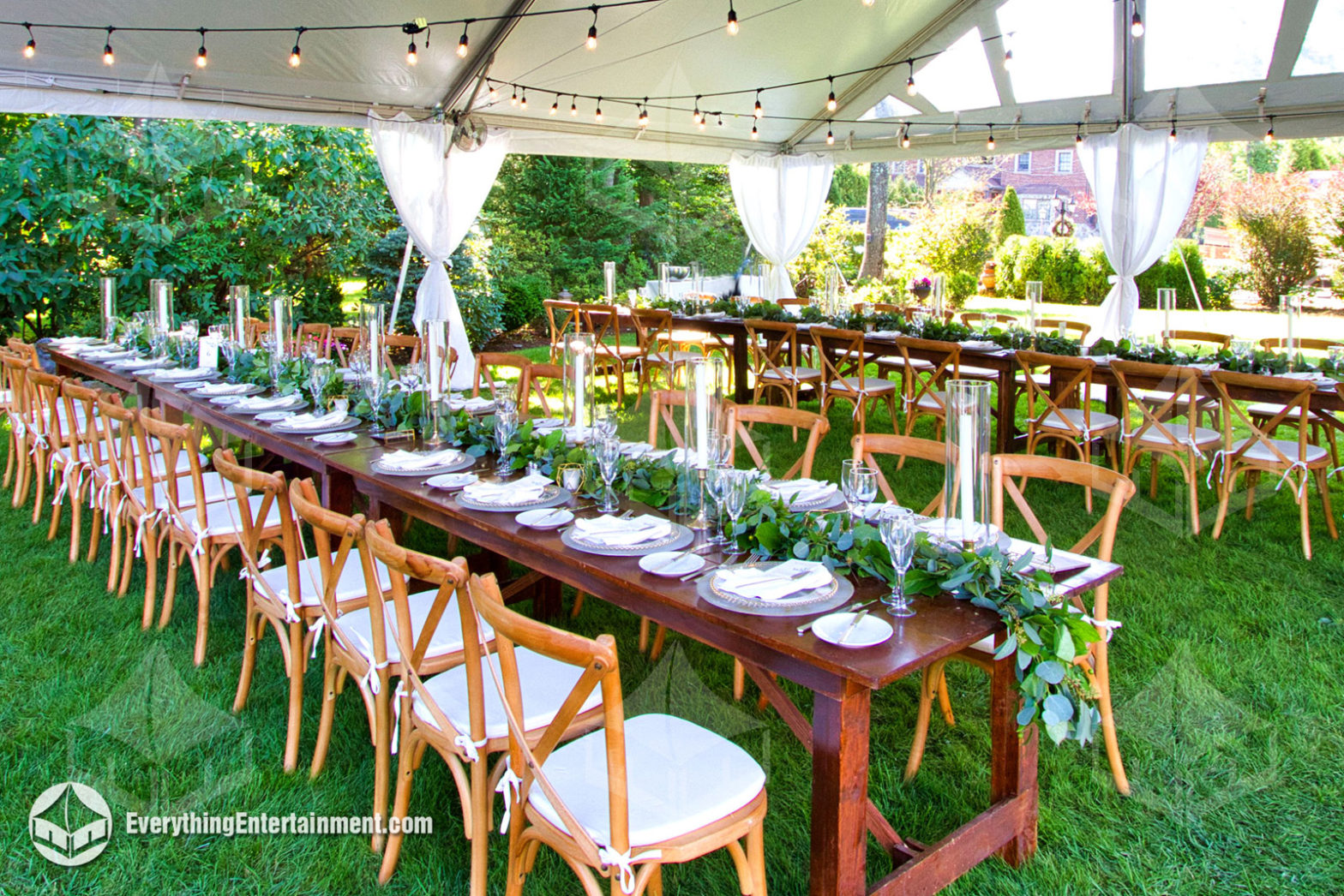 rustic theme wedding tables and chairs inside tent